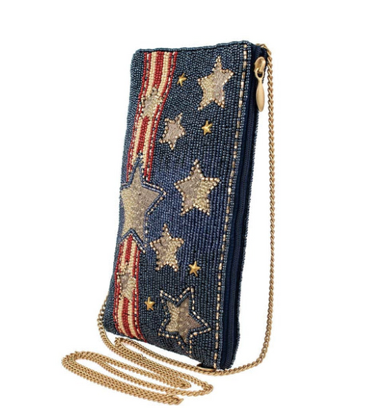 Side view of Mary Frances Americana crossbody phone bag showing chain strap and zipper compartment