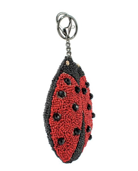 Image showing the left side of a beaded coin purse/key fob with a lady bug design by Mary Frances