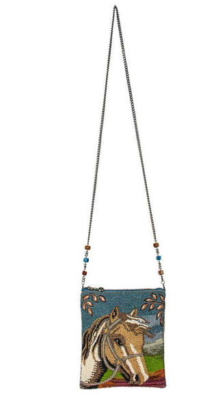An image of Spirited crossbody handbag by Mary Frances featuring a horse and an embellished chain strap.